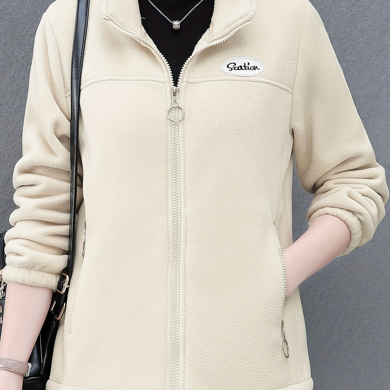 Women's casual fleece jacket with alphabet pattern, stand collar, long sleeves, regular fit, oversized, and zipper detail.