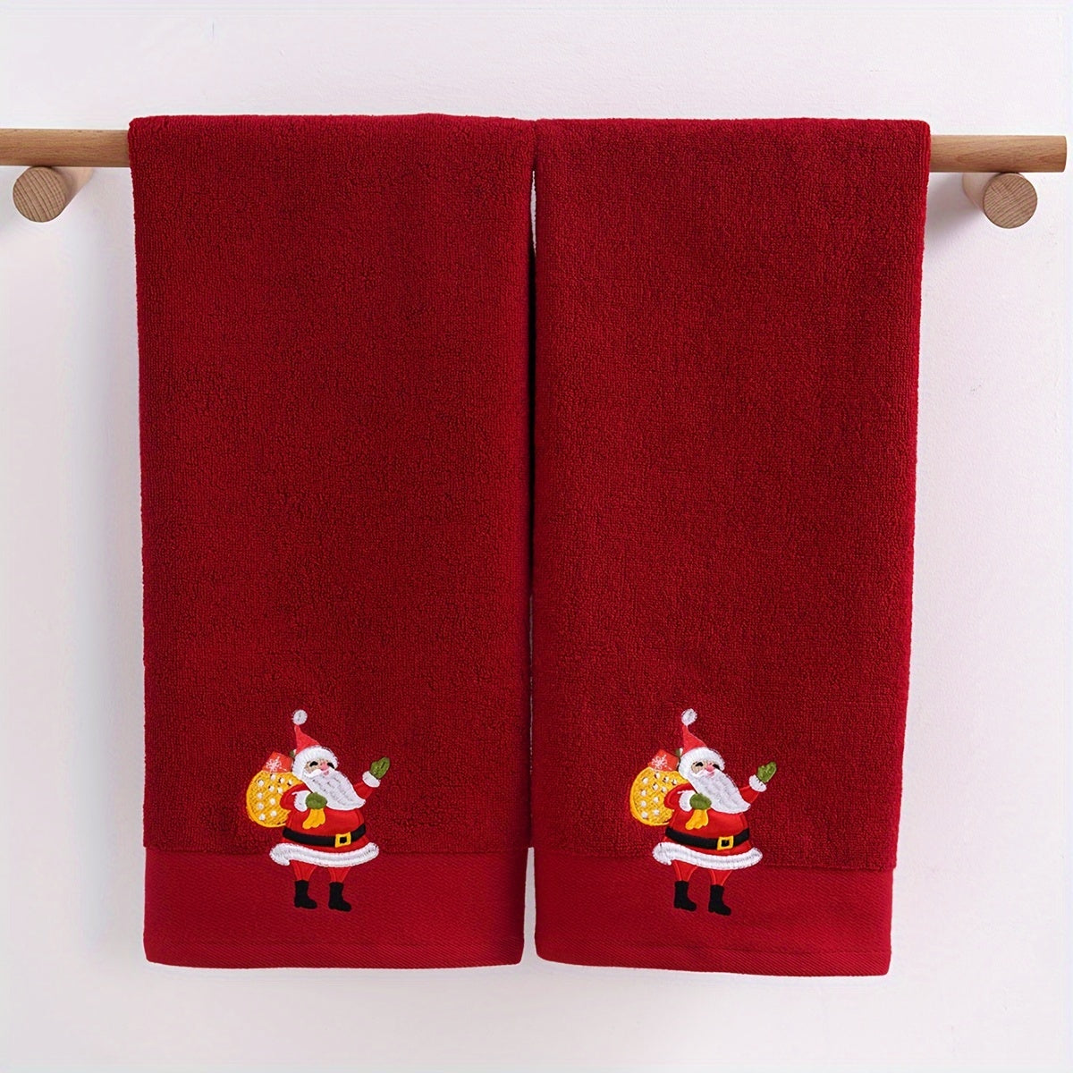 2 QIBHI Vintage Christmas Reindeer embroidered hand towels made from 100% cotton knit fabric. Cartoon-themed oblong bathroom towels perfect for festive holiday gifts. Hand wash only, 450gsm. Adds a playful holiday motif and soft festive texture to your