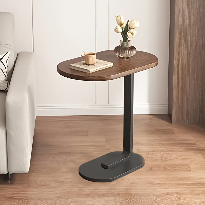 Modern C-shaped sofa side table made of walnut wood and iron, with a sturdy black frame. Compact and durable design suitable for various spaces.