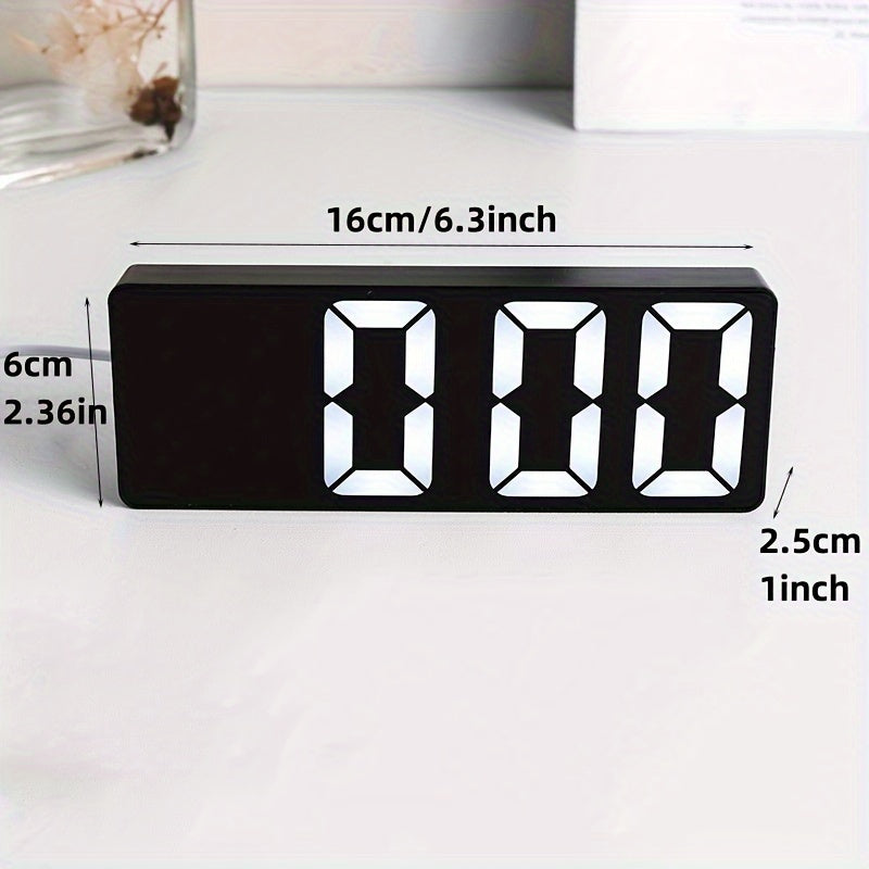 Digital clock with large LED display, mirror surface, dual brightness levels, and battery or USB charging, ideal for home décor.