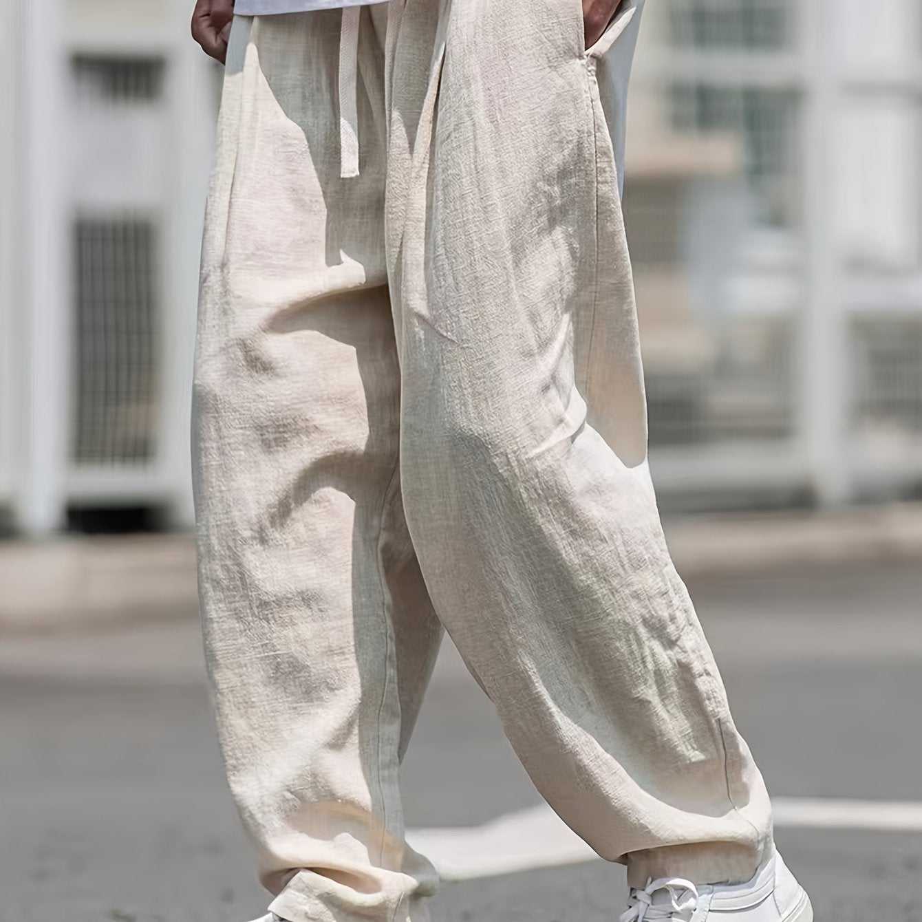 Street style drawstring trousers for men with a loose fit.