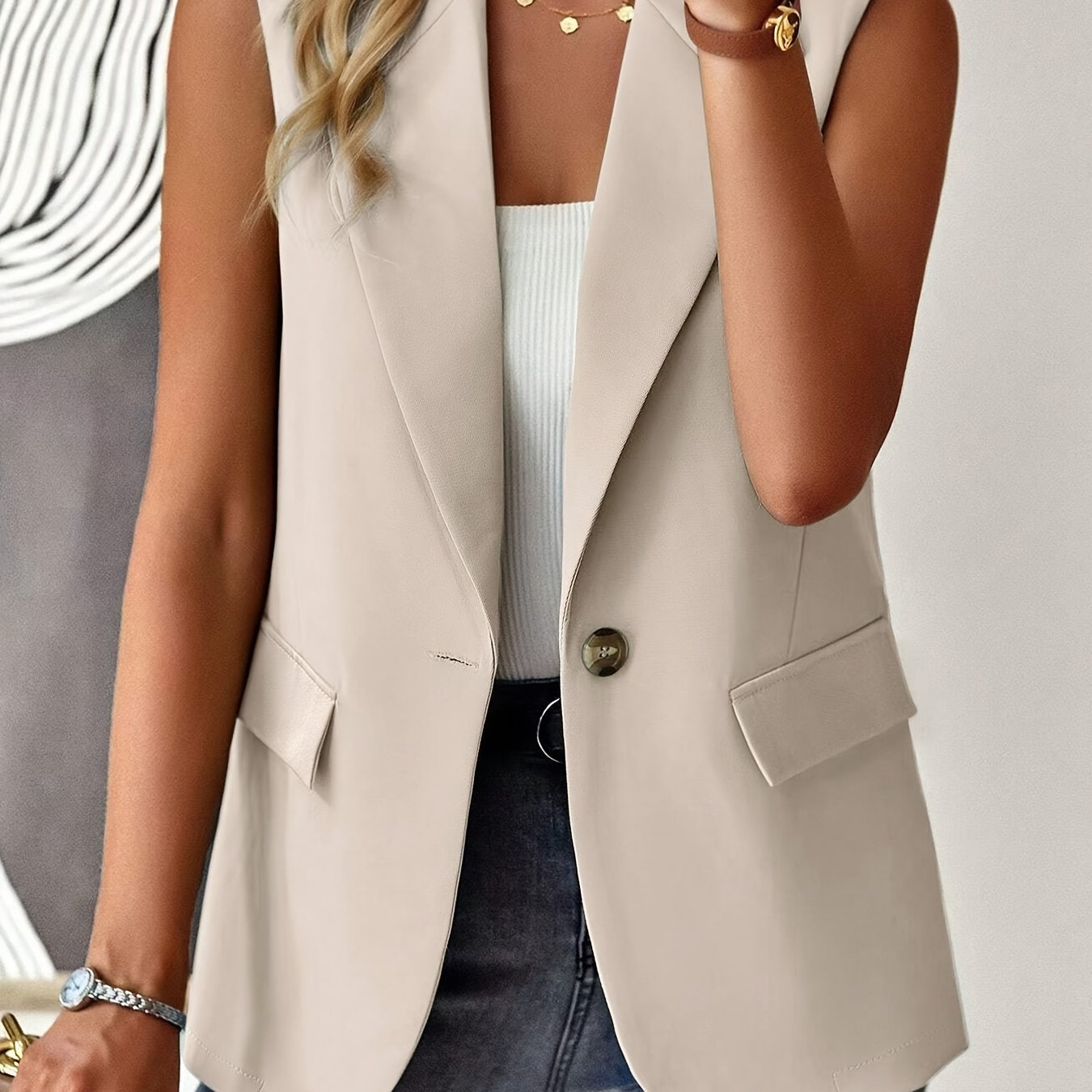 Sleeveless button front lapel vest in a solid color, suitable for spring and fall. Ideal for women's clothing.