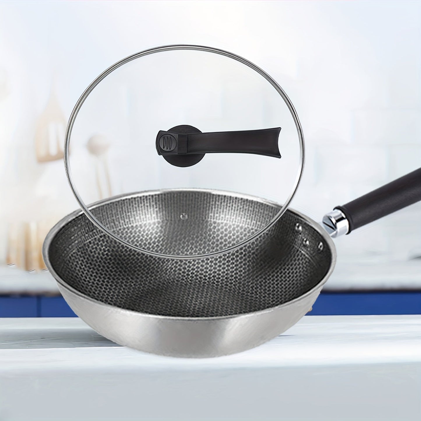 One high-quality stainless steel honeycomb wok with a reinforced glass lid - features non-stick, food-safe cast iron and a standable design for convenient storage.