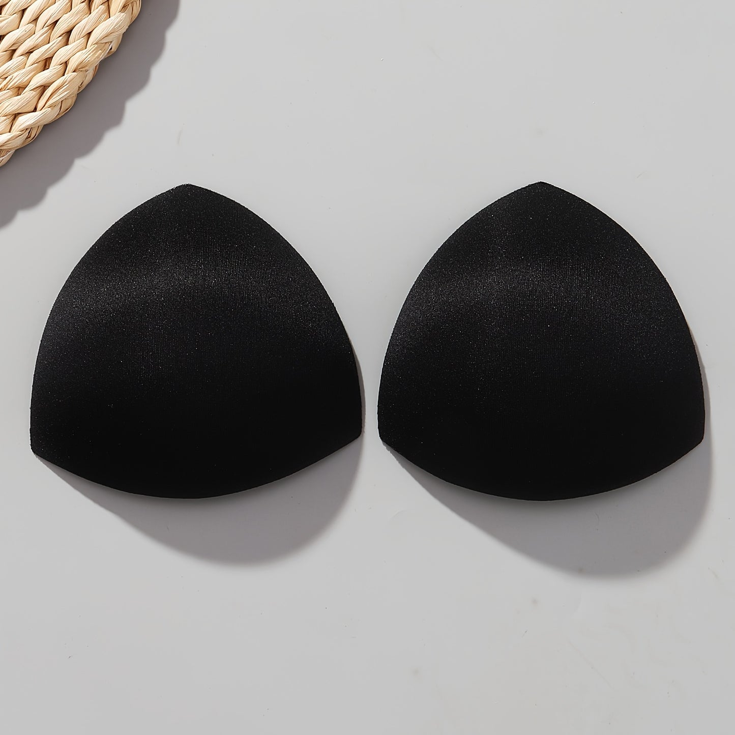 Women's triangle bra pads enhance and lift with push-up and adjustable features. Available in black, white, and nude colors.