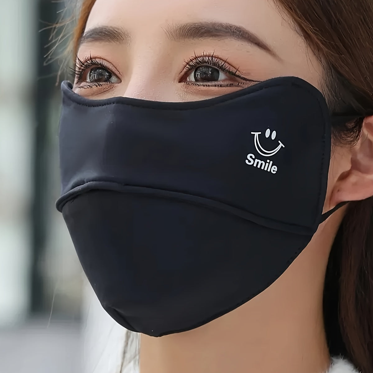 One adorable smiling graphic mask in a solid color, perfect for cycling and casual wear, provides windproof and dustproof protection for women.