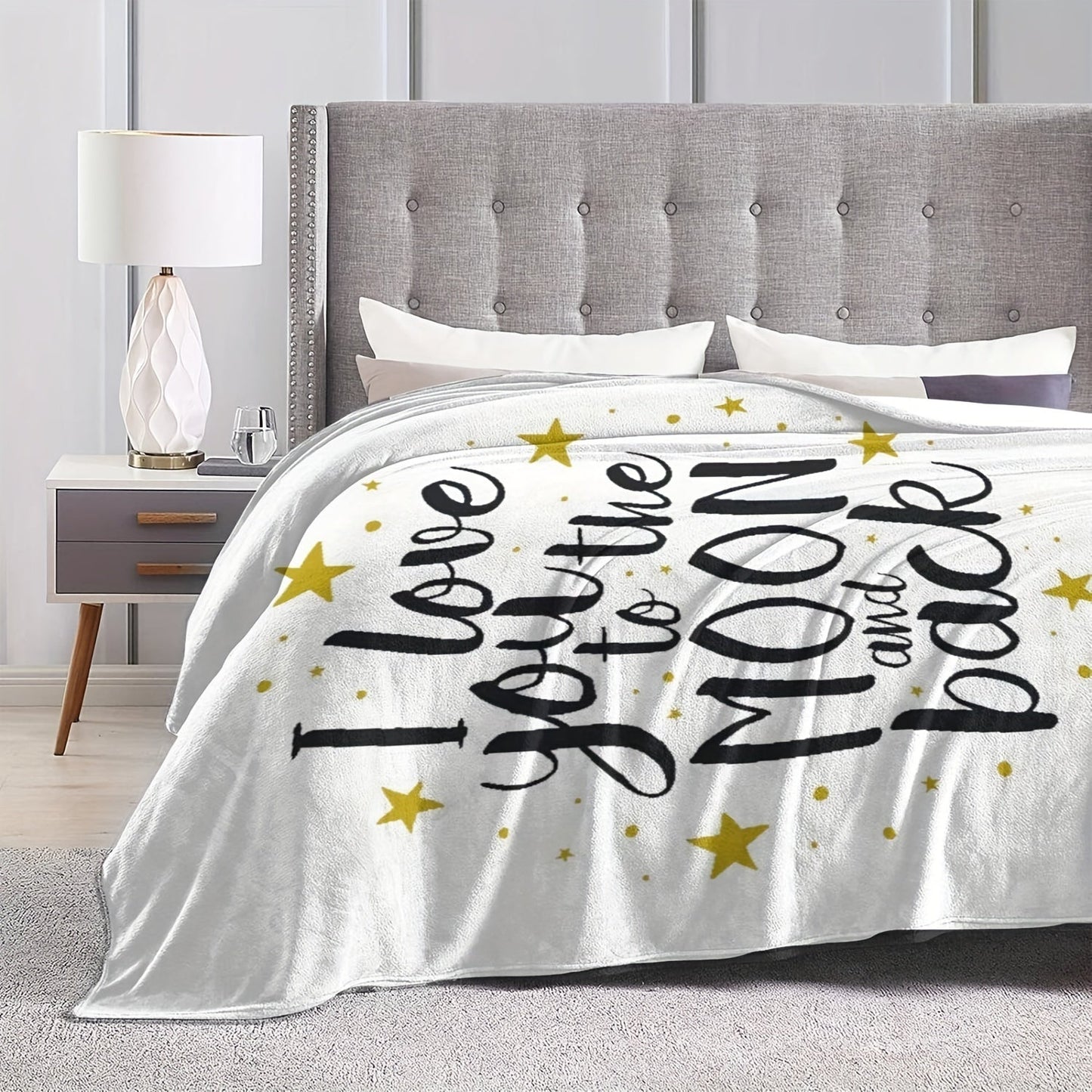 Soft flannel throw blanket with the message "I Love You To The Moon And Back", perfect for adding warmth and style to your home decor. Suitable for couches, beds, sofas, and living rooms.