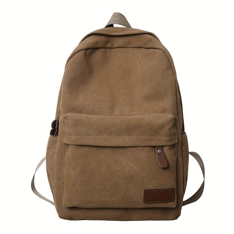 Sturdy canvas backpack with adjustable straps, perfect for school, travel, and work, fits 15-inch laptop.