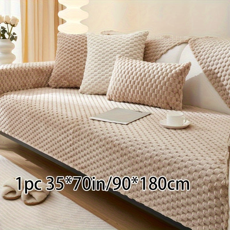 Non-slip sofa cover with honeycomb pattern, ideal for all seasons and protecting furniture in any room.