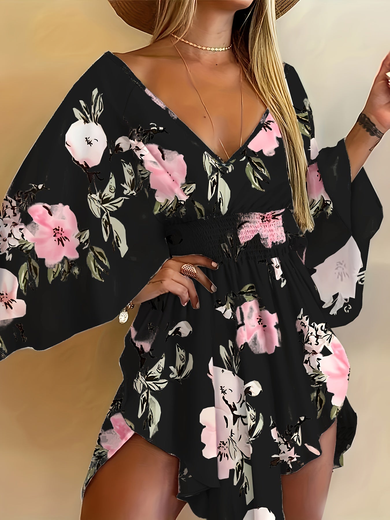 Floral print V-neck dress with tie waist and flare sleeves for spring and summer.