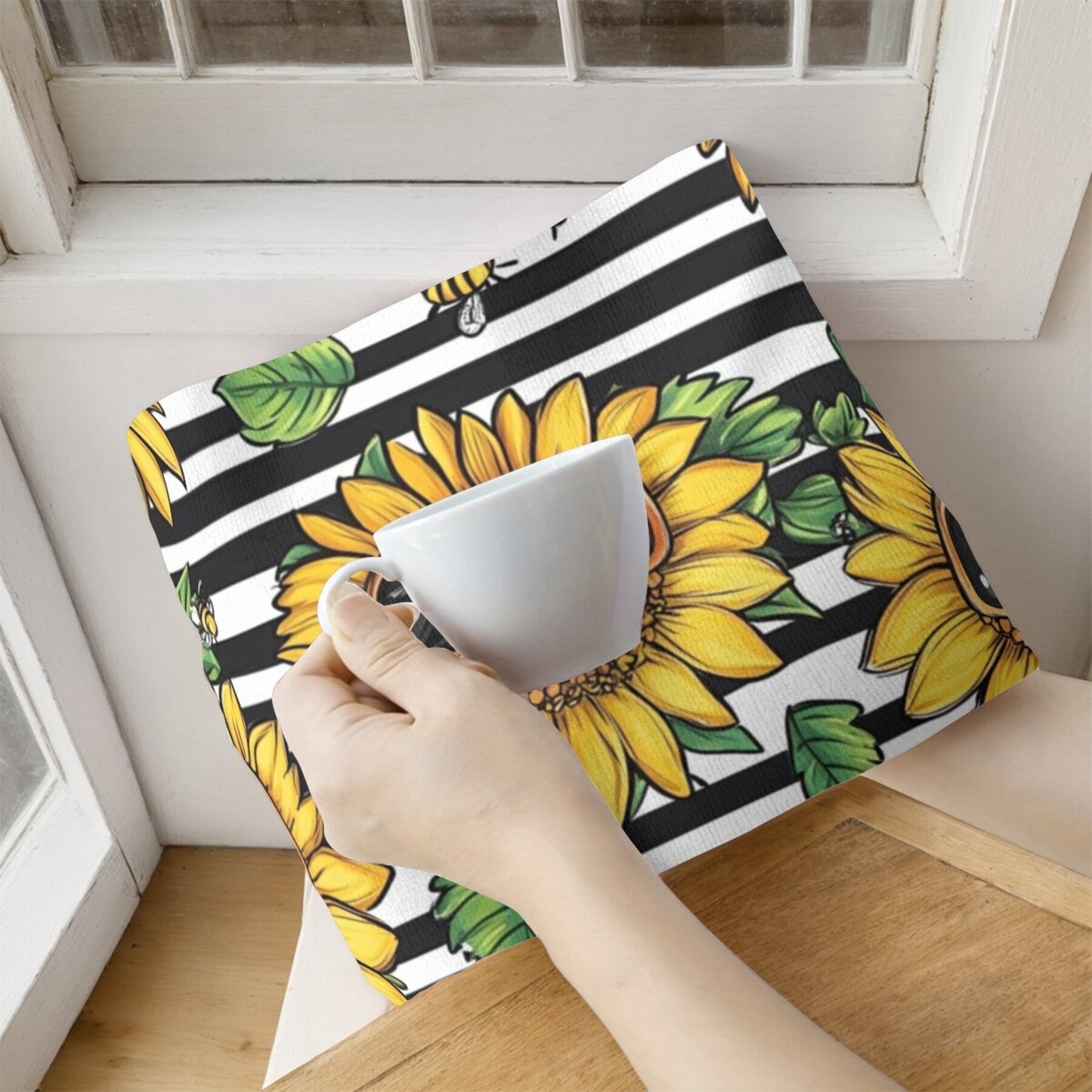 Two pieces of contemporary dish cloths featuring a sunflower pattern, made of woven polyester material. These oblong kitchen towels are designed with a floral theme and are suitable for hand wash only. Ideal for use in the kitchen.