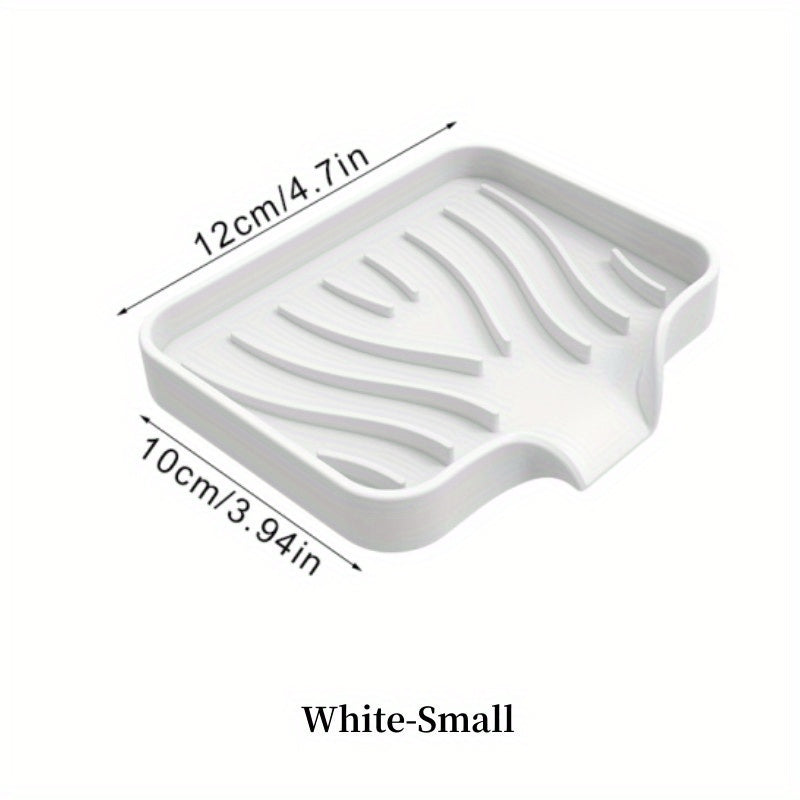 Silicone soap dish with self-draining design for countertop or sink storage in bathroom.