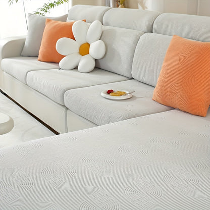 Jacquard sofa slipcover with universal fit and elastic design for furniture protection and home decor in any room.