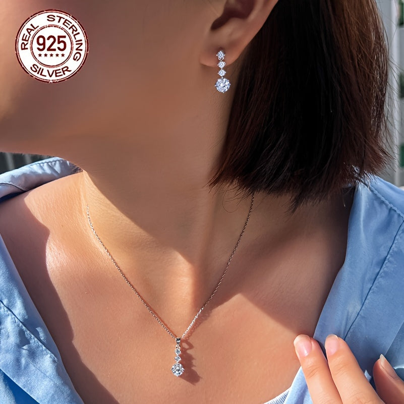 One set of elegant 925 sterling silver jewelry featuring classic 4-roundel drop earrings and pendant necklace with synthetic cubic zirconia. Perfect for daily wear or as a gift for Valentine's Day for women. Silver plated for added shine.