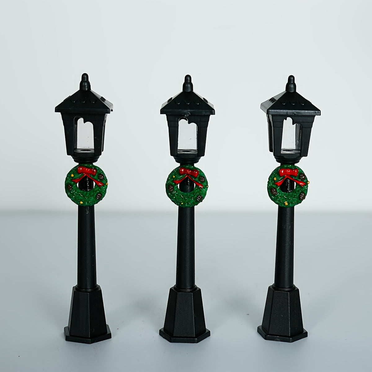 3 Miniature Christmas Lamp Posts with Wreaths, Collectible Seasonal Figurines, Plastic Material, No Electricity Needed