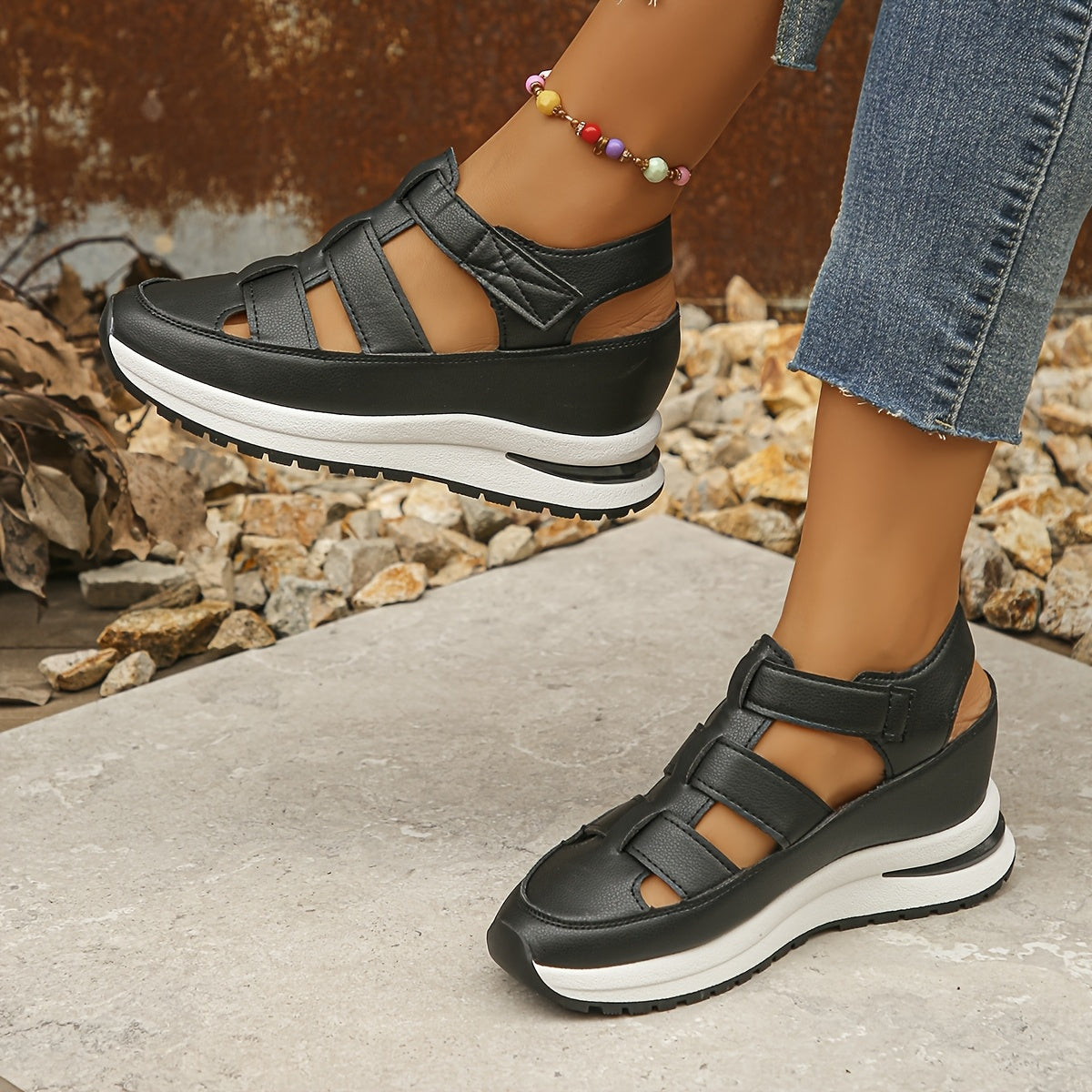 Stylish wedge sandals with hidden height, thick sole and hook-and-loop closure for comfort and versatility.