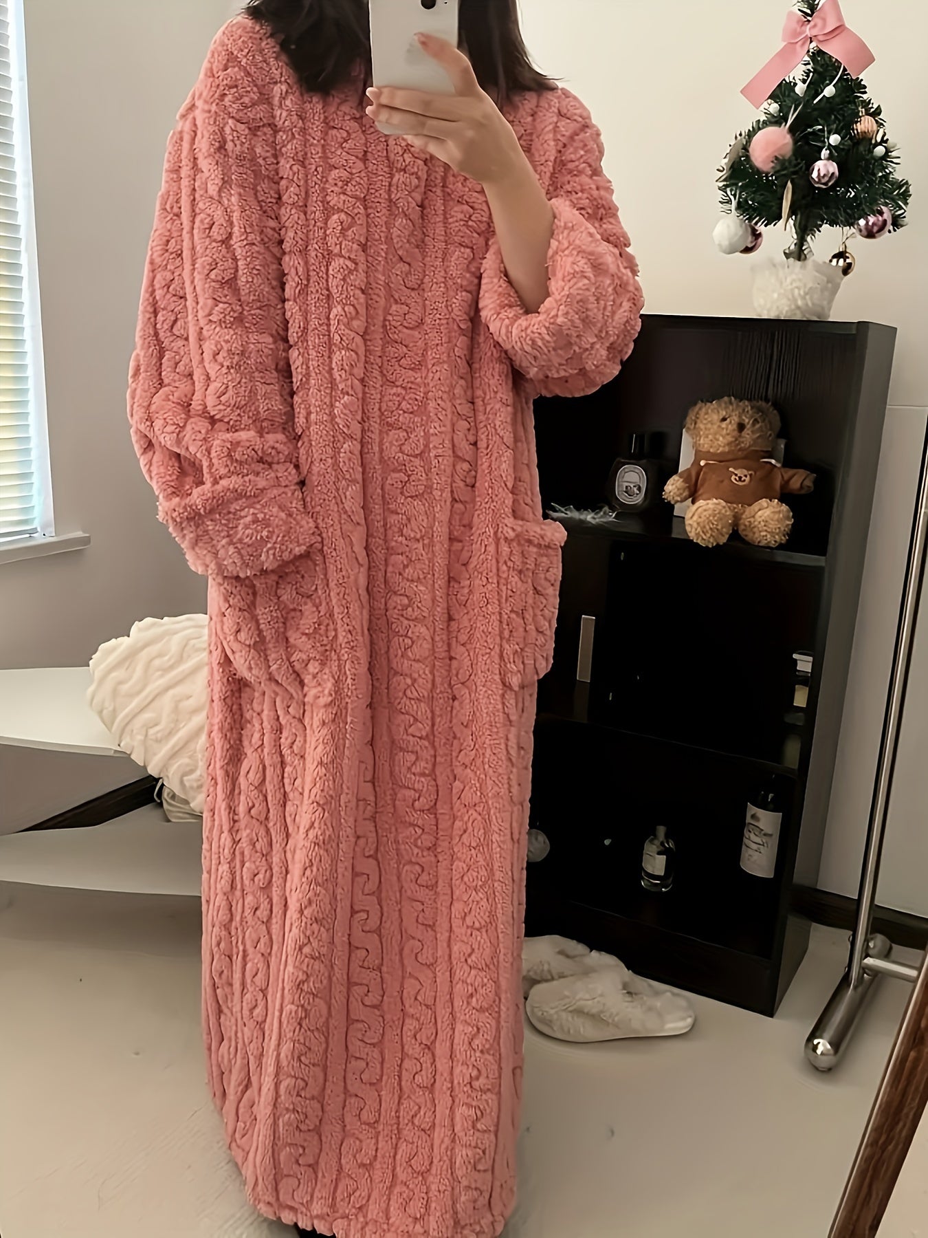 Cozy coral fleece nightdress with pockets, perfect for winter.