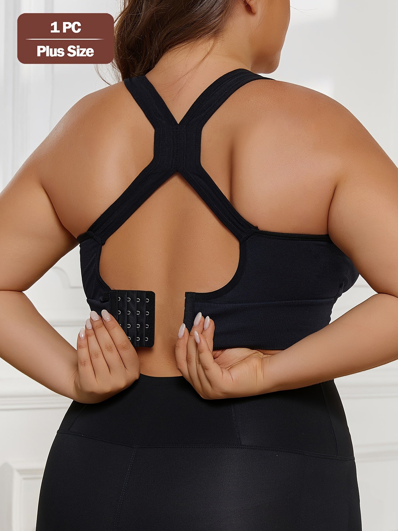 Plus Size Seamless Sports Bra made of solid color knit fabric with medium stretch, composed of 83% polyamide and 17% elastane. Features removable padding, wireless design, and a lightweight