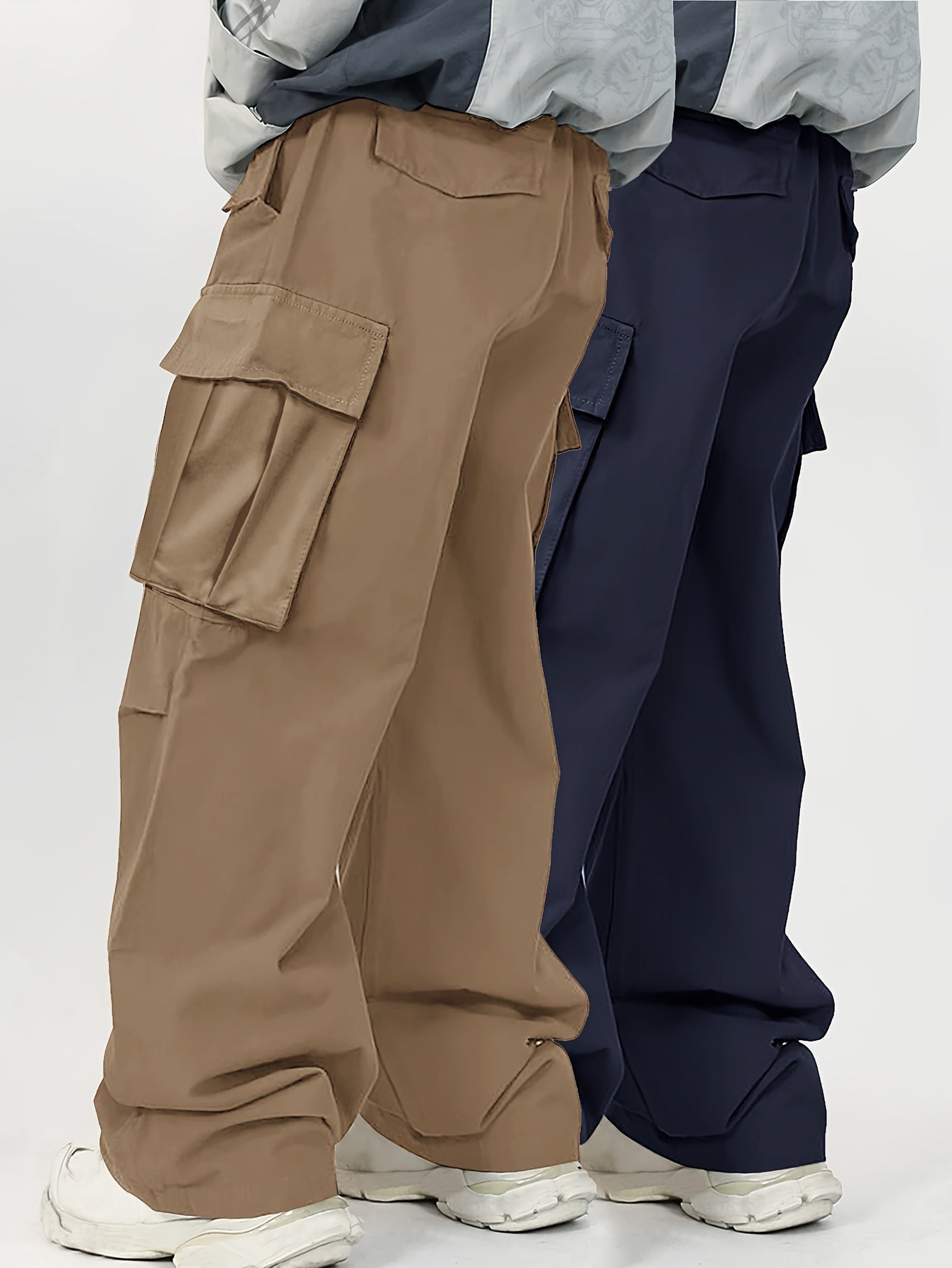 Two men's casual cargo pants with flap pockets in a solid color, loose fit, made of machine-washable polyester.