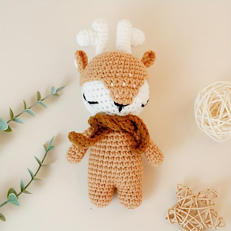 The perfect first Christmas gift for newborns: a handmade crochet baby animal Christmas reindeer doll. Perfect for little ones to snuggle with during the holiday season.