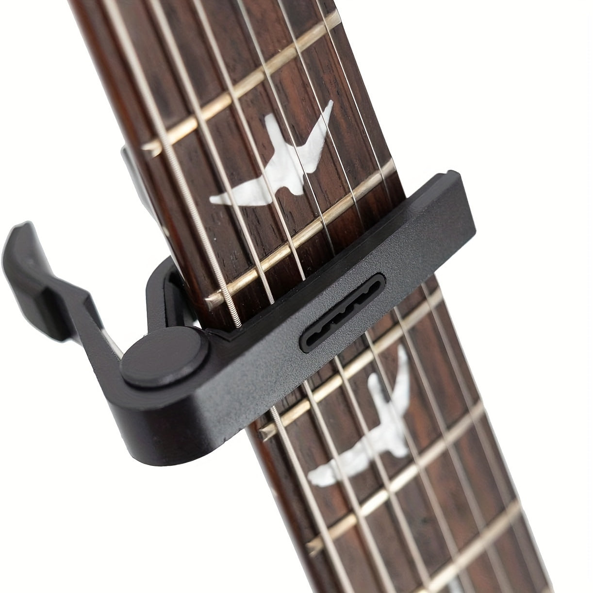 Rosewood guitar capo with pick holder, ideal for a variety of instruments. Comes with picks.