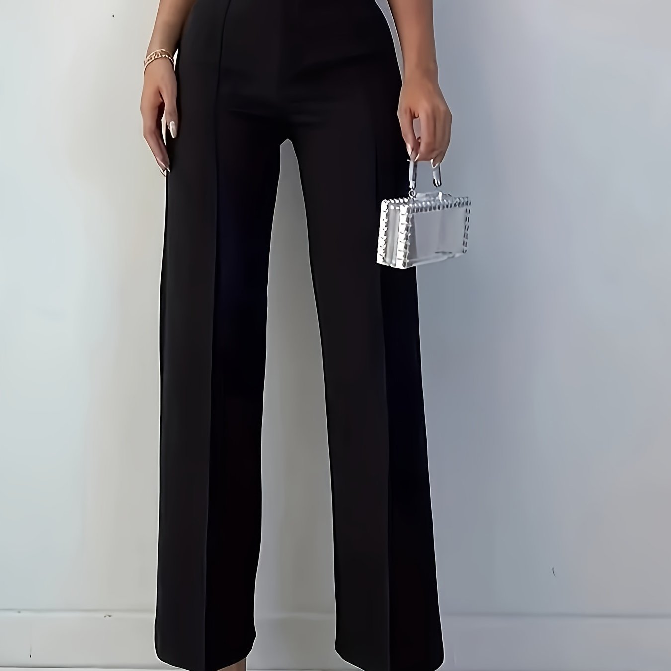 Stylish women's black pants, high-waisted, sleek polyester material, machine washable - suitable for professional and social occasions.