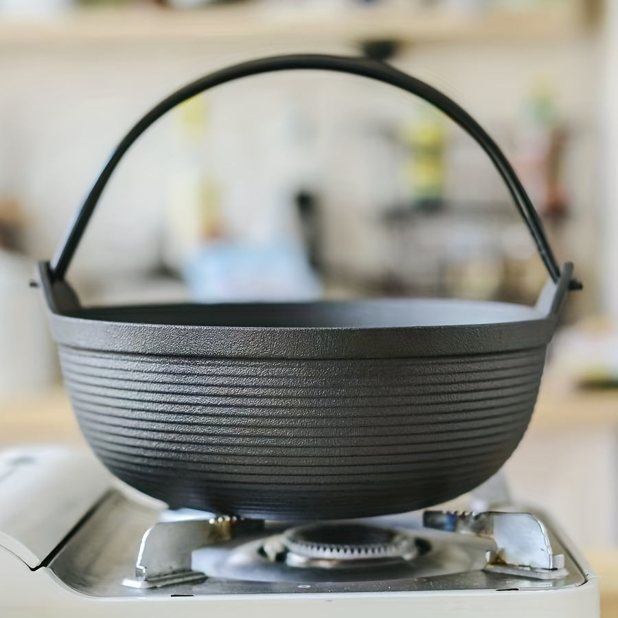 Japanese stew pot, featuring a cast iron construction that is handmade without any coating. This pot is thickened and high temperature resistant, making it perfect for traditional Japanese dishes like sukiyaki and hearty soups. Enjoy the old-fashioned