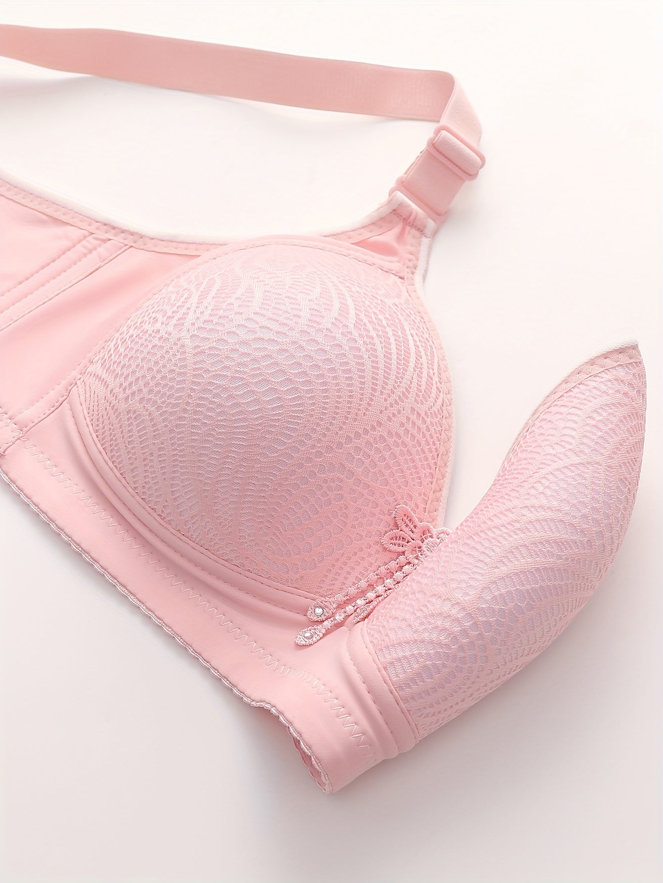 Printed, mature-style full-coverage bra with adjustable, wireless design and secure closure.