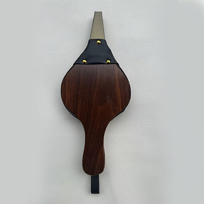 Traditional fireplace bellows tool made from handcrafted wooden corrugated pipe adorned with black faux leather and brass rivets, designed for efficient airflow in wood stoves, fire pits, and camping. Perfect addition to your fireplace accessories.