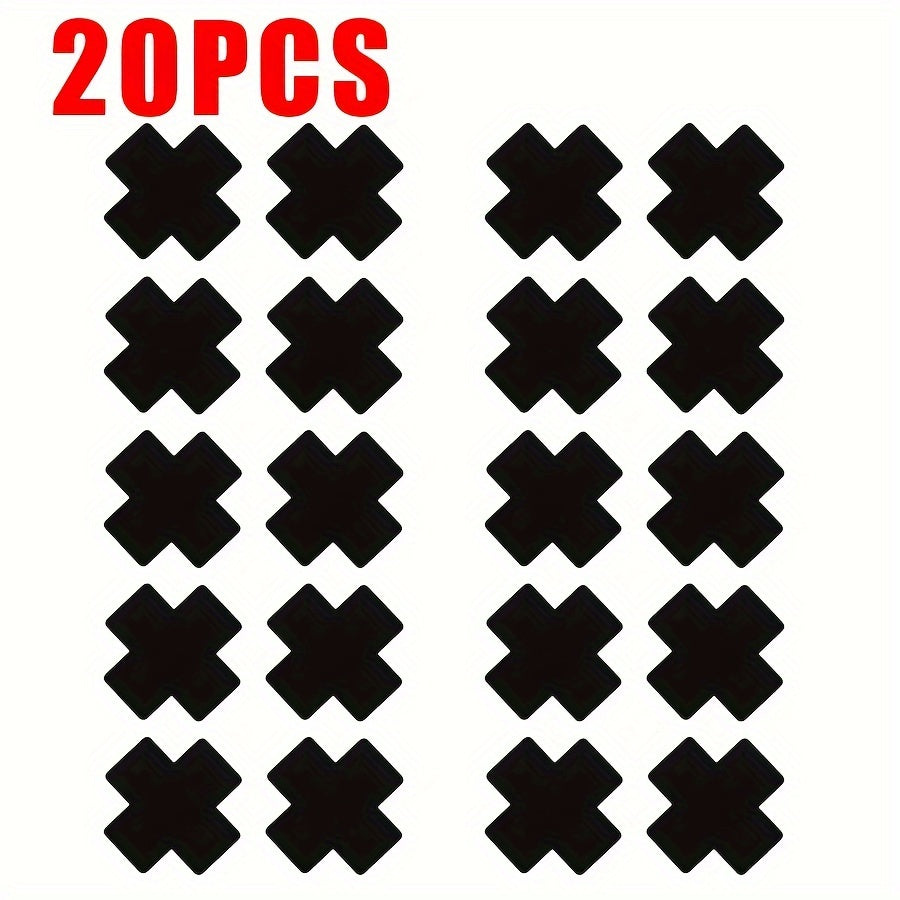 20 self-adhesive, disposable black cross-shaped satin nipple covers for strapless outfits. Made of polyester, a women’s fashion accessory.