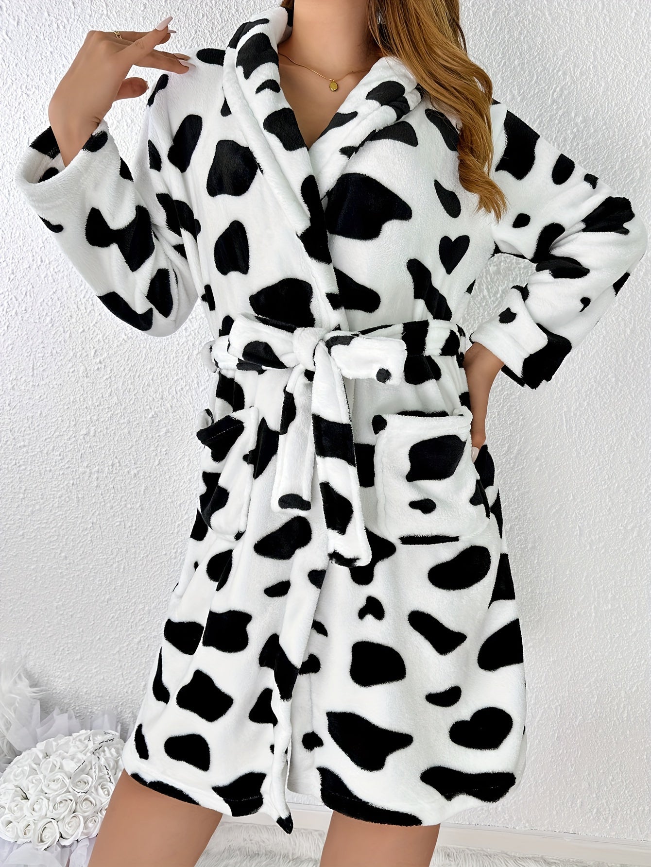 Cow print robe for women with long sleeves, belt, and pockets. Comfy sleepwear.