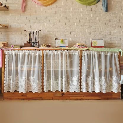 This affordable Lace Small Flower Cafe Curtain is dainty and charming, perfect for adding a touch of elegance to your kitchen or dining room. The curtain features a rod pocket design and is made of delicate white lace, making it suitable for window and