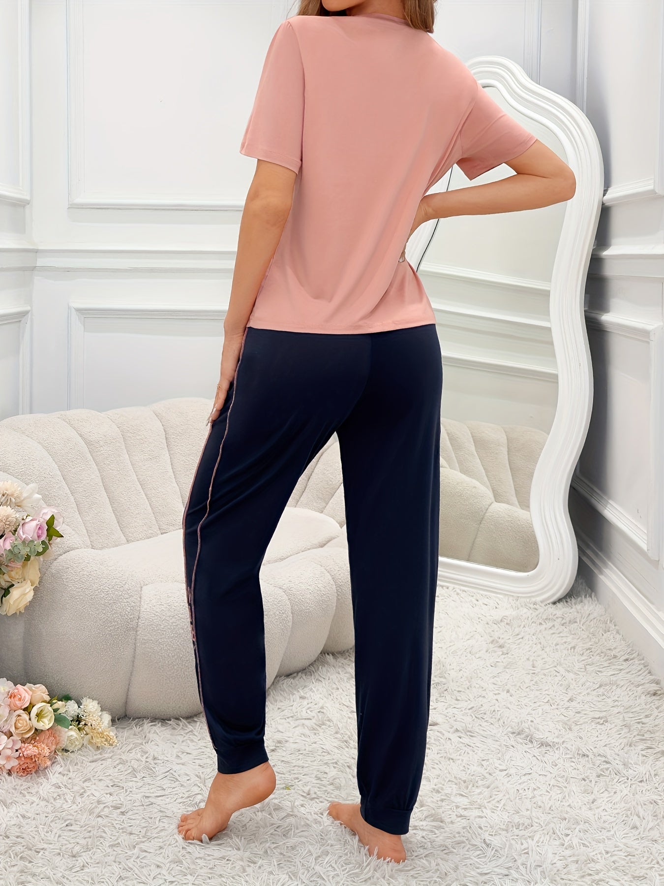 Women's casual lounge set with letter print, short sleeve top, round neck, jogger pants, relaxed fit.