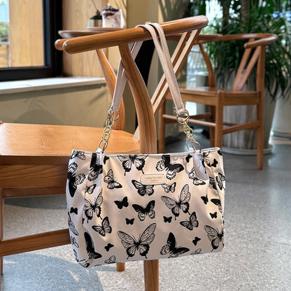 Stylish tote bag for women featuring a floral butterfly design, ideal for daily use and travel, also makes a lovely gift.