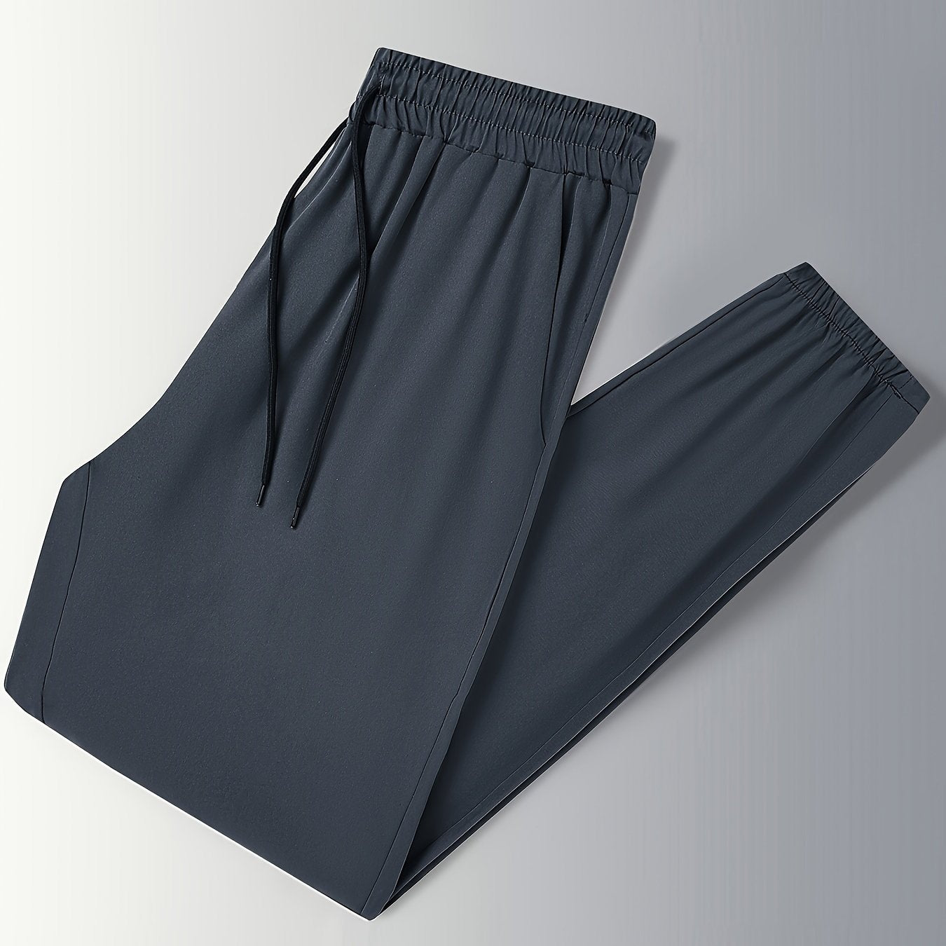 Men's drawstring trousers with pockets for outdoor activities in spring and summer.