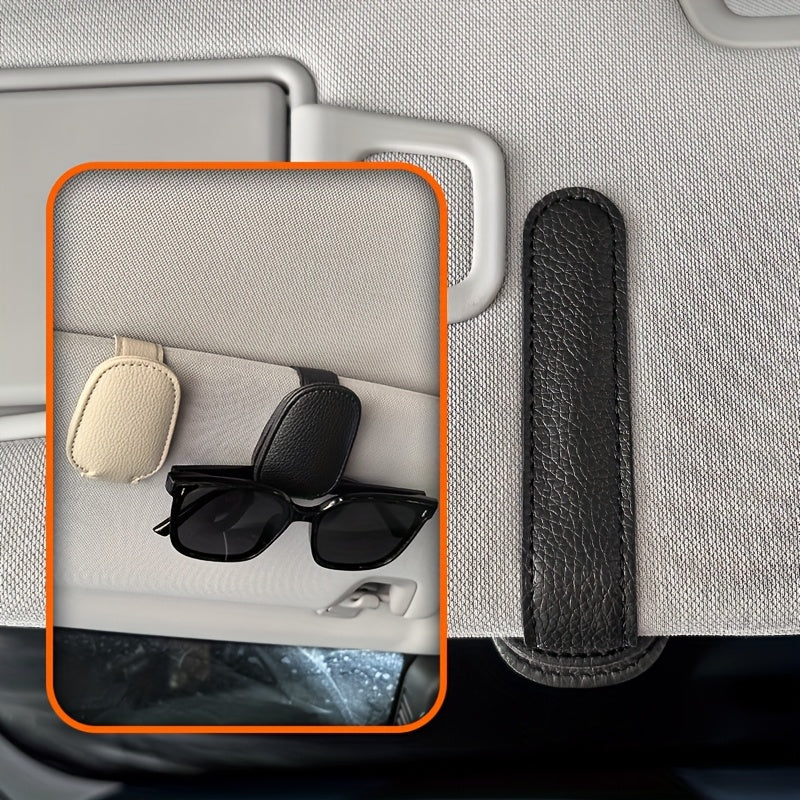 Universal car sun visor clip made of PVC material for storing eyeglasses in the vehicle interior.