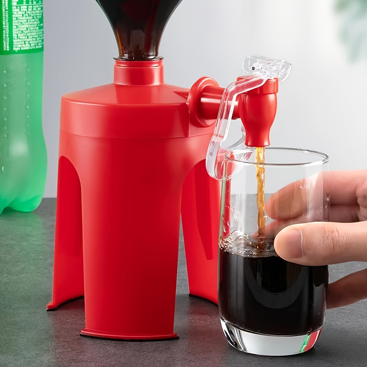 Durable plastic manual bottle inverter for mess-free pouring from soda and water bottles.