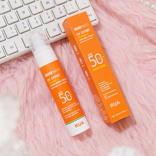 Non-greasy Vitamin C sunscreen for face and body, ideal for outdoor activities on sunny days.