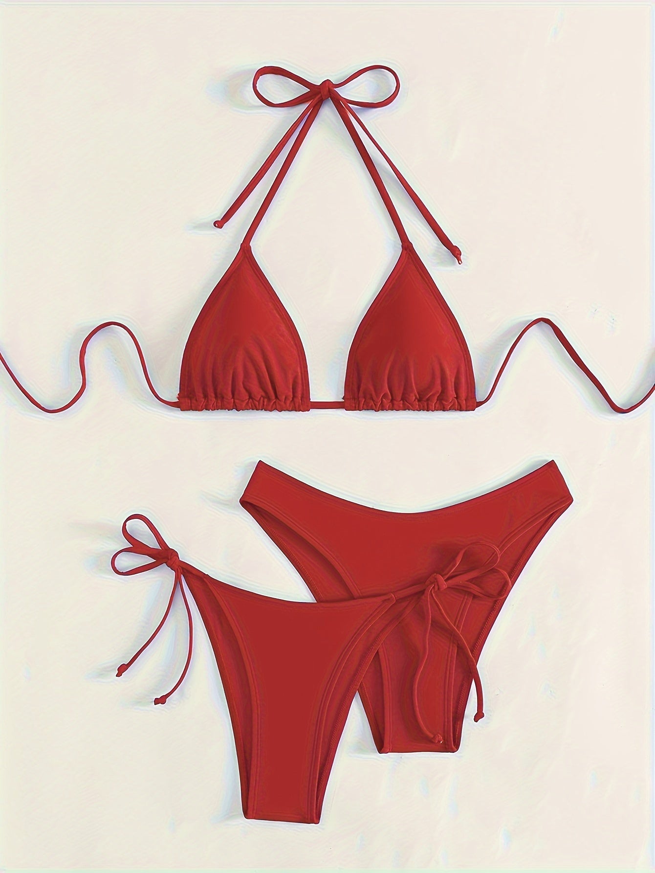 Solid color 3-piece bikini set with halter neck and backless design. Ideal for women's swimwear and clothing.