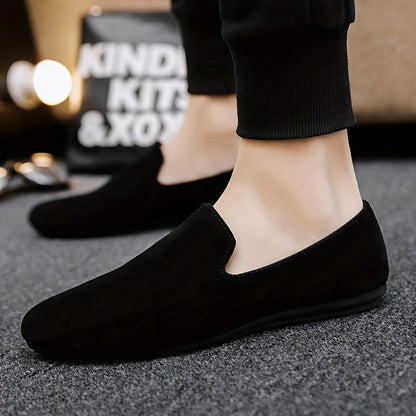 Men's black slip-on loafers with round toe and PVC sole for fashionably casual everyday wear in Spring/Summer 2024.