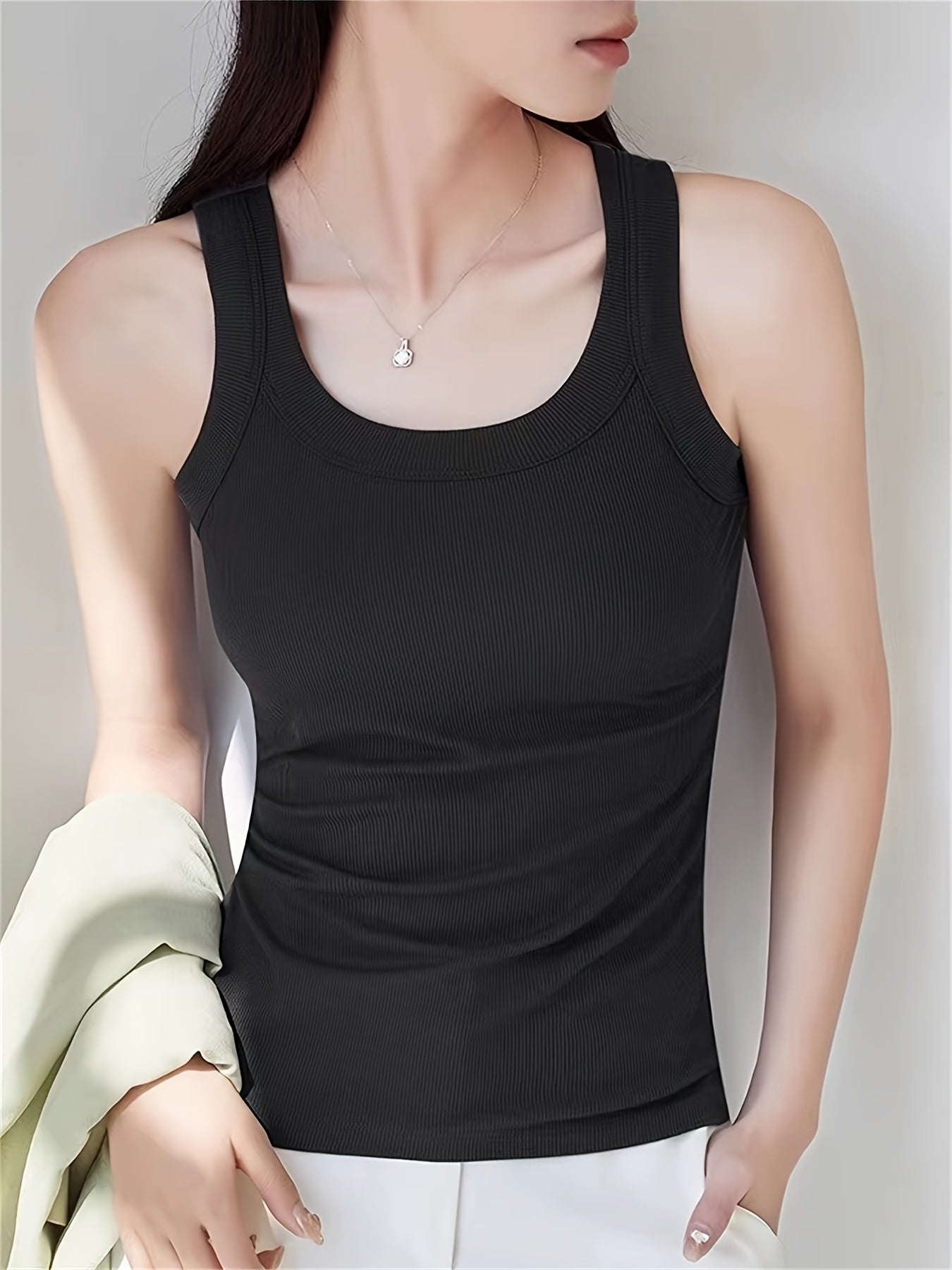 Set of 4 U-neck camisole vests for women, perfect for spring/summer. Can be worn as an outer layer or as a sleeveless base shirt. Features low neckline for breathability and comfort.