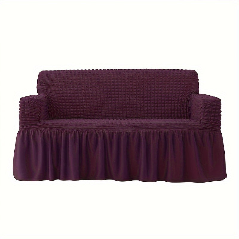 Non-slip elastic sofa cover with skirt for home decor.