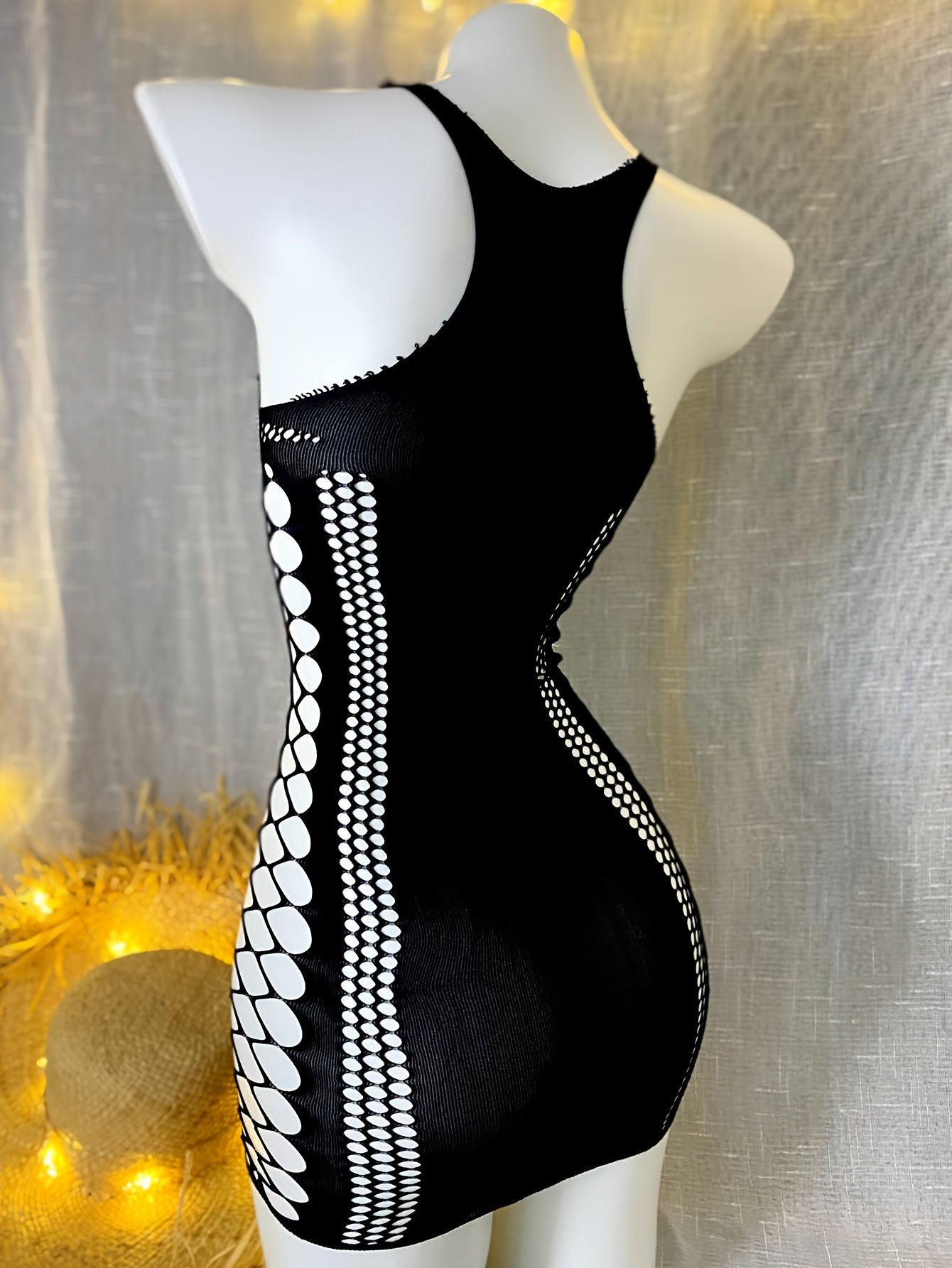 Bodycon dress with fishnet hollow out design, made of 95% polyamide and 5% elastane. High stretch knit fabric in solid color, perfect for beachwear and summer clothing. Ideal for music