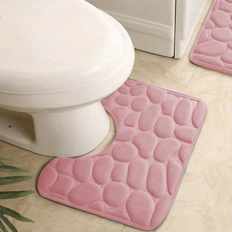 U-shaped foam bath rug with fast absorbency, non-slip design, and washable features. Perfect for bathroom decor.