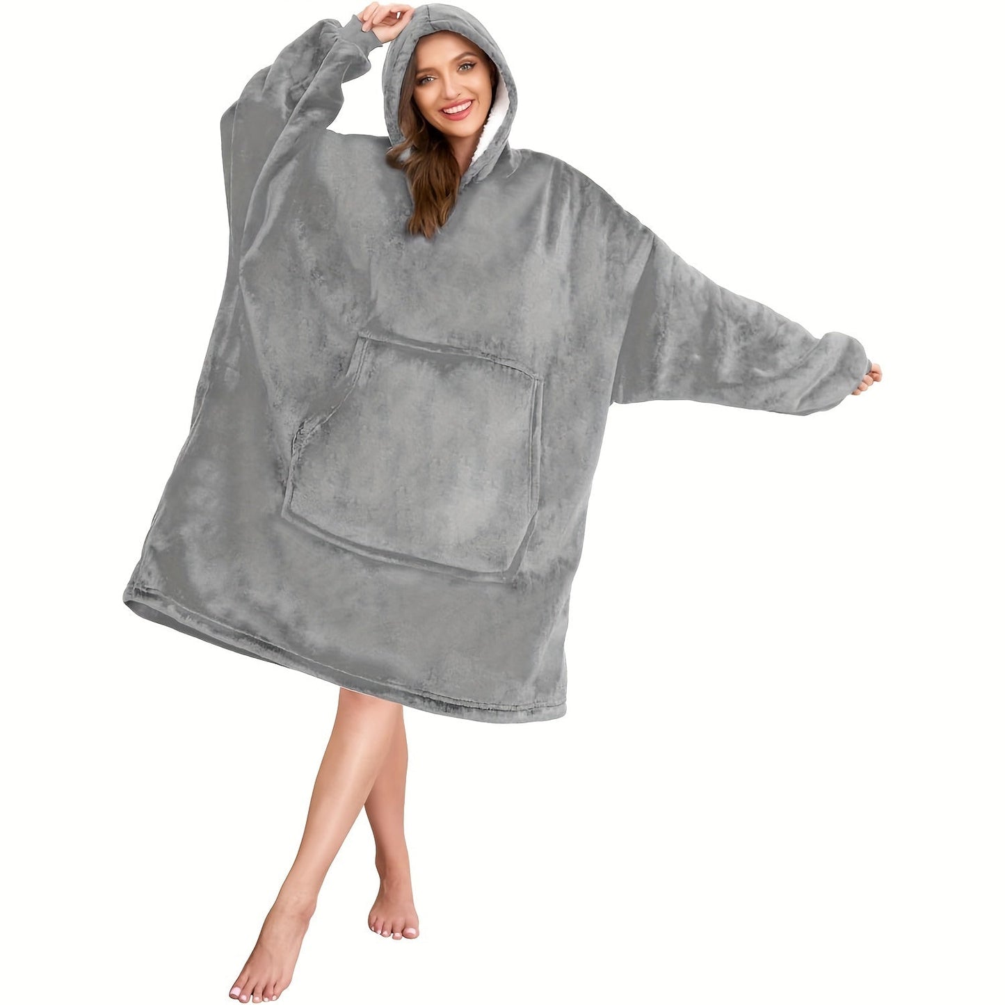 One piece of an oversized hooded blanket made from super soft flannel fabric. This wearable blanket features a stylish hood and a convenient pocket, providing warmth and comfort in cold weather.