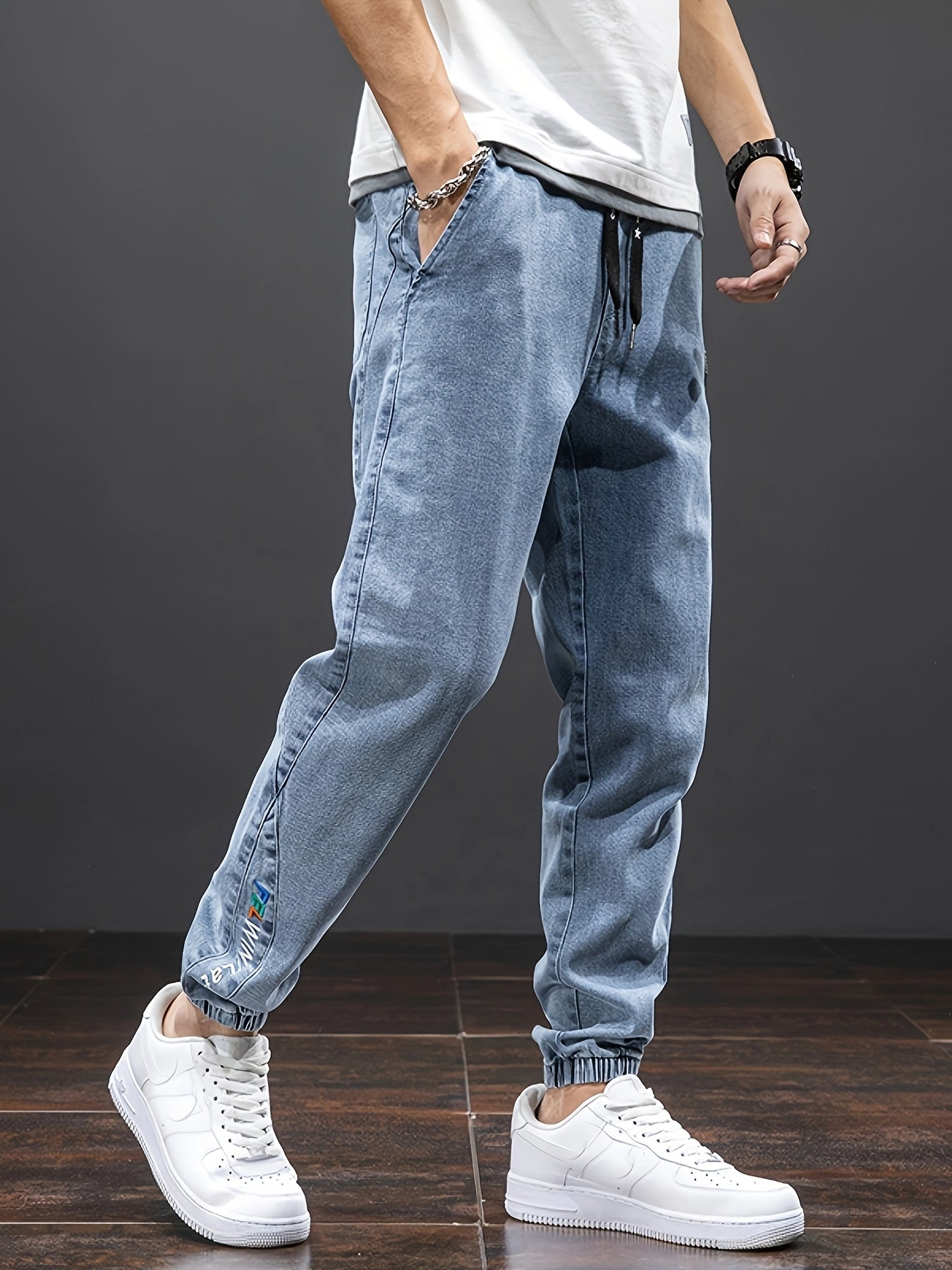 Men's mid-rise cropped jeans with elastic waistband made of 70.7% blend, solid color washed denim, regular fit for all-season wear.