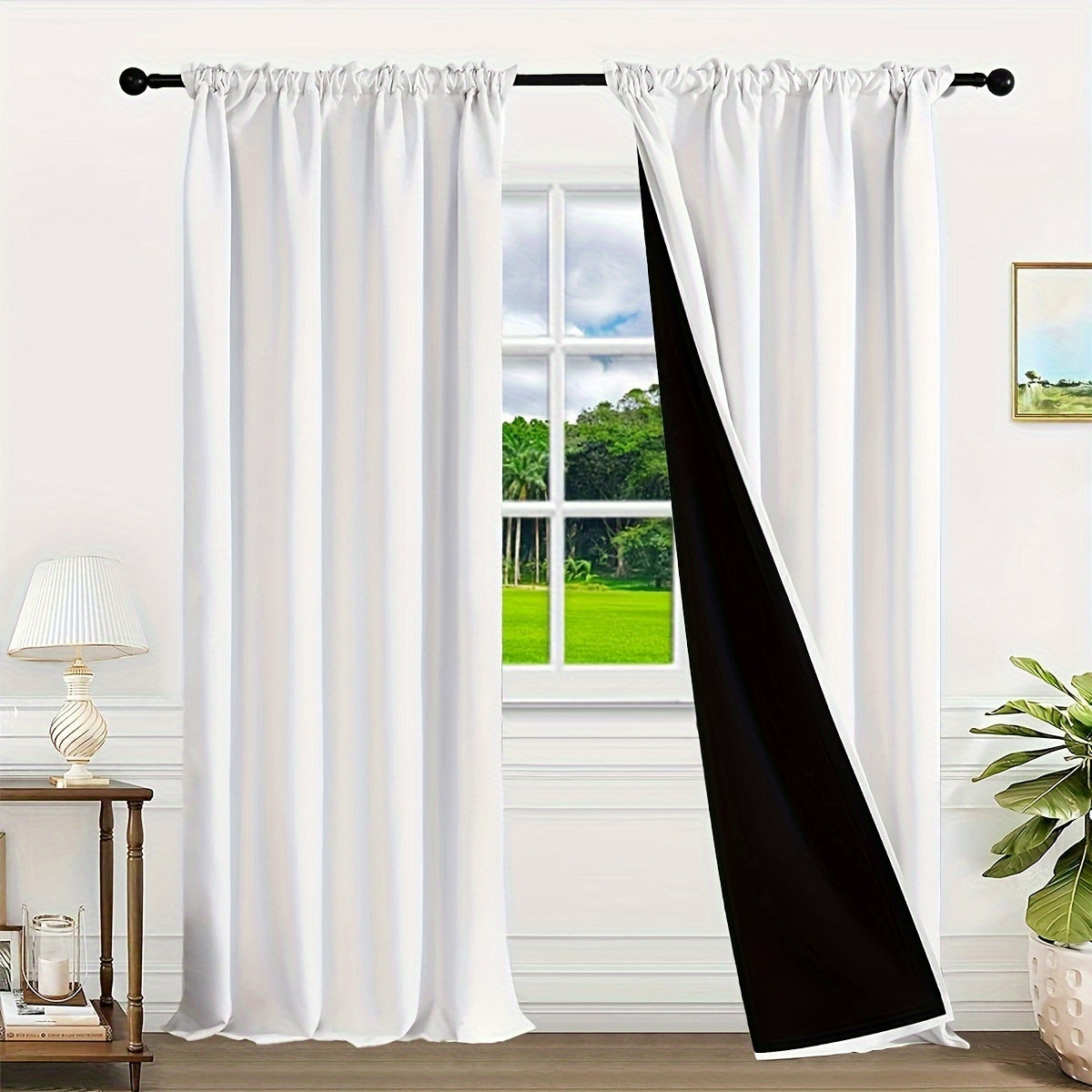 Two pieces of contemporary blackout curtains made from thermal insulated twill weave polyester. They are designed to reduce noise and block out light, making them perfect for the living room, bedroom, or study. These curtains feature a hook and ring rod