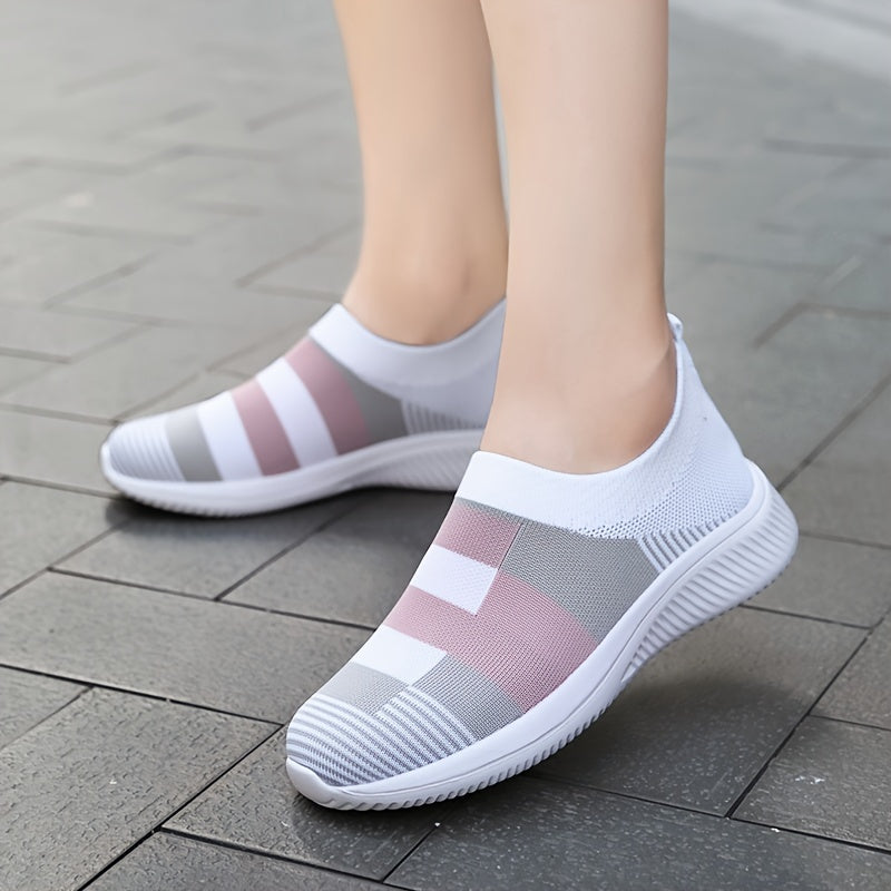 Breathable mesh slip-on sneakers for plus size women in pink, gray, and white plaid with soft sole and round toe design, suitable for all seasons.