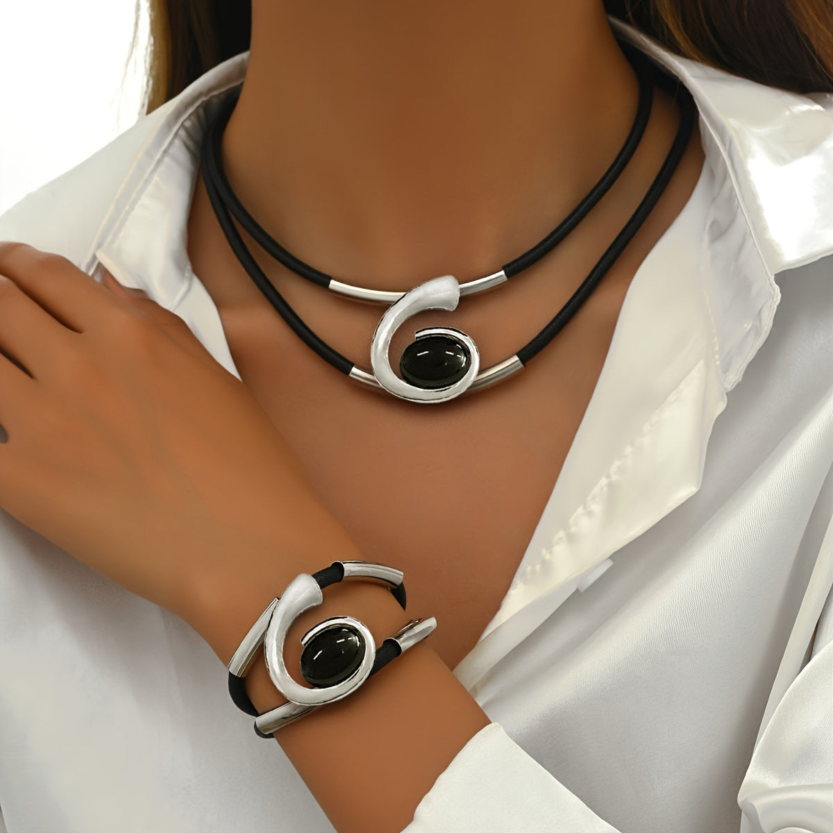 Set of two stylish double-row black imitation PU braided rope bracelets with metal pipe accents, paired with a black resin geometric spiral necklace and bracelet set. Perfect for women to wear as versatile daily or party jewelry.