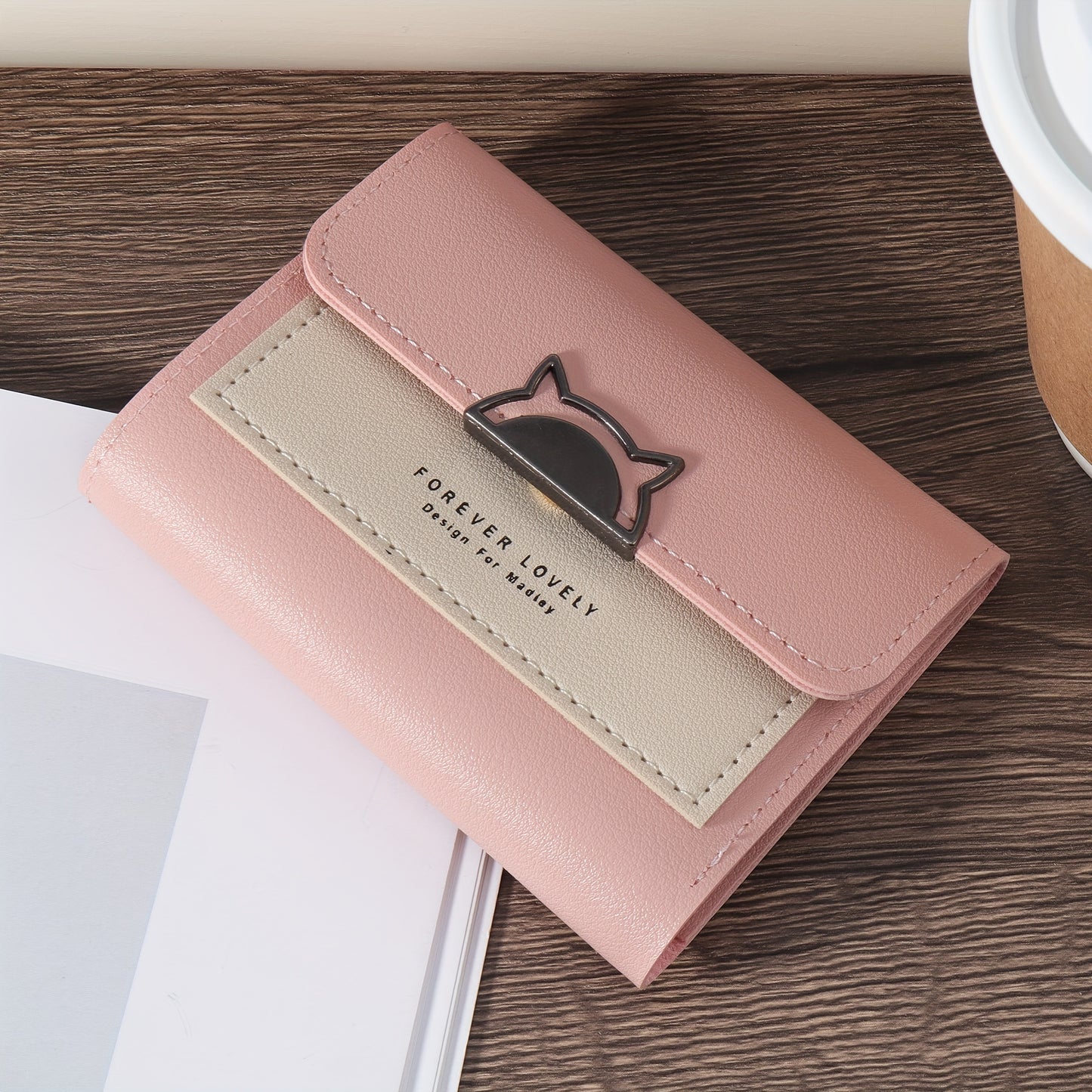 Compact folding wallet with cat metal decor, multiple card slots and coin pocket, available in red, pink, or black.