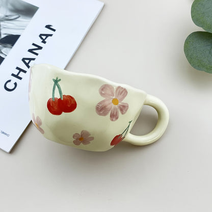 Ceramic mug with flowers pattern, irregular shape, Korean style, suitable for coffee, milk, tea, oatmeal, and breakfast.